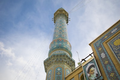 a tall tower with a clock on it's side