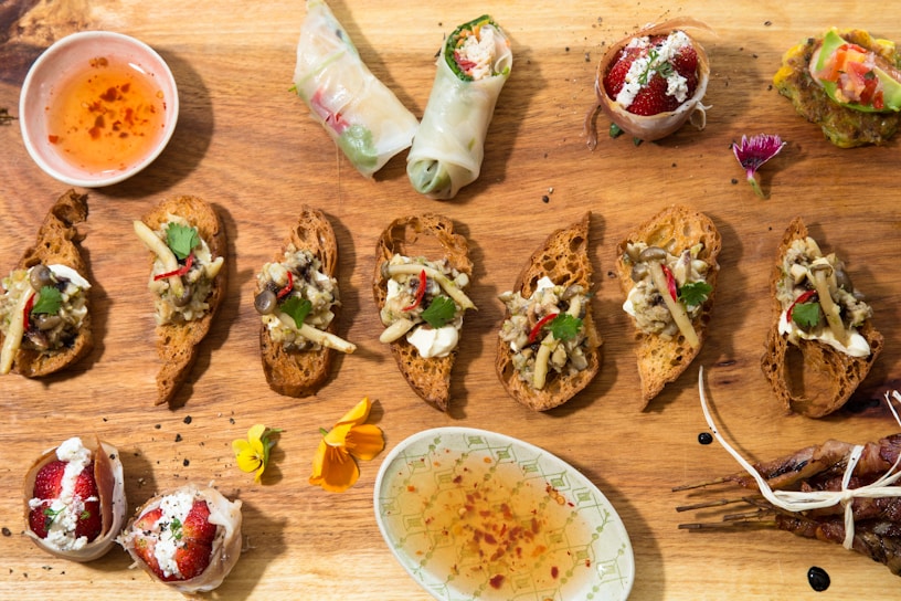 A vibrant spread of fresh appetizers artfully arranged on rustic wooden platters.