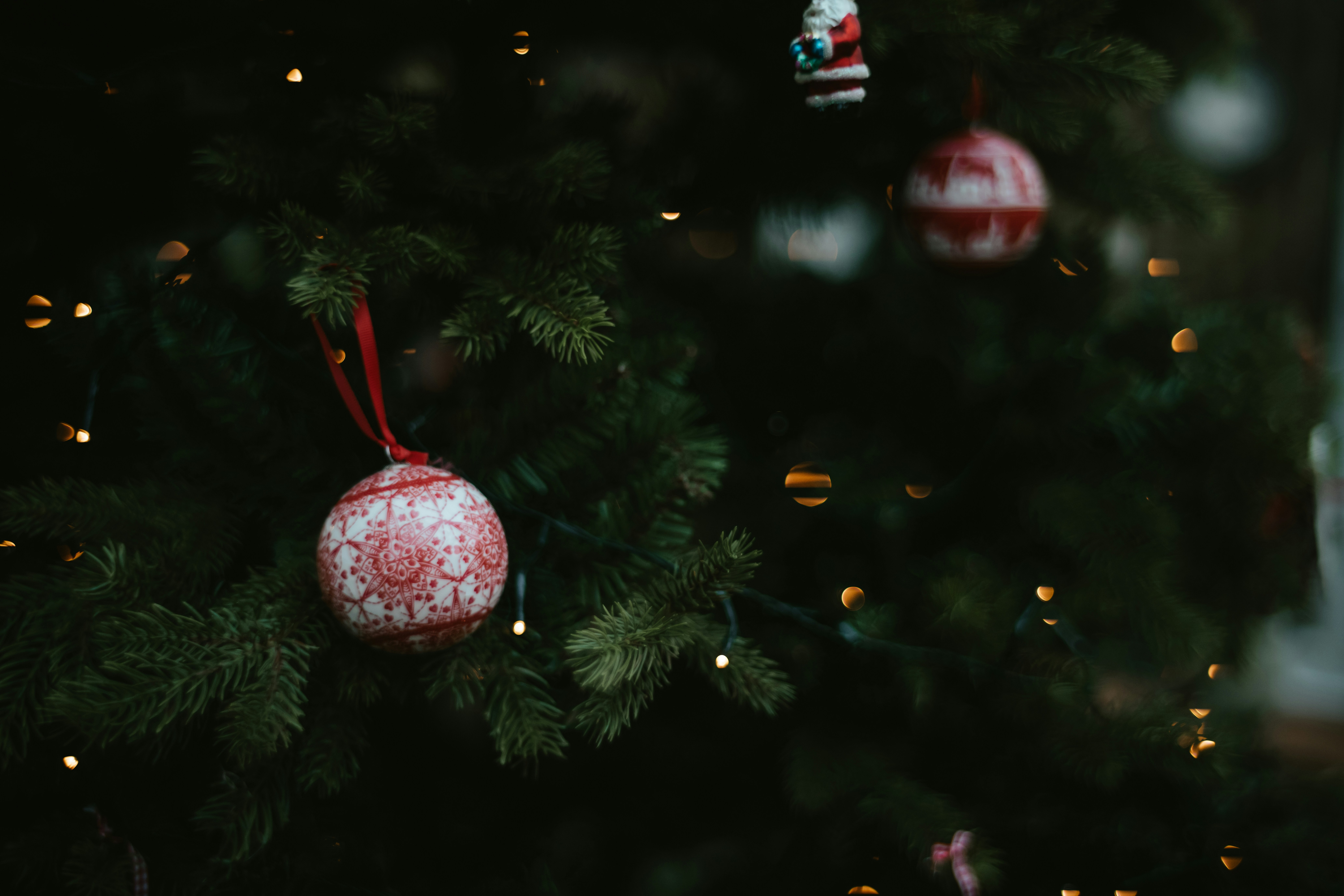a christmas tree with ornaments hanging from it