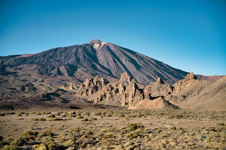a mountain in the middle of a desert