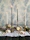 Bright and airy photo of handcrafted wooden baptism favors arranged with soft pastel decorations.