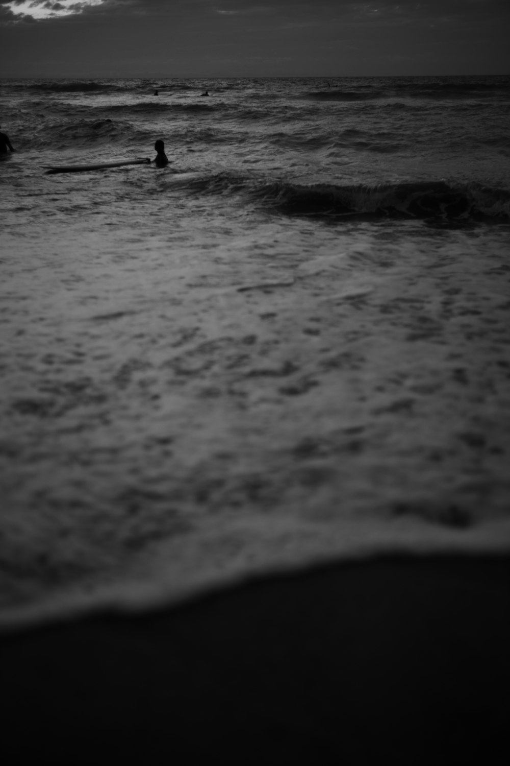 a person riding a surfboard on a wave in the ocean