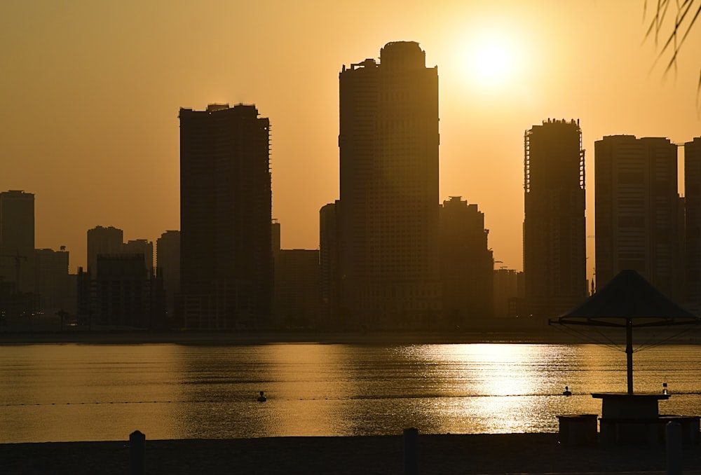 the sun is setting over a large city