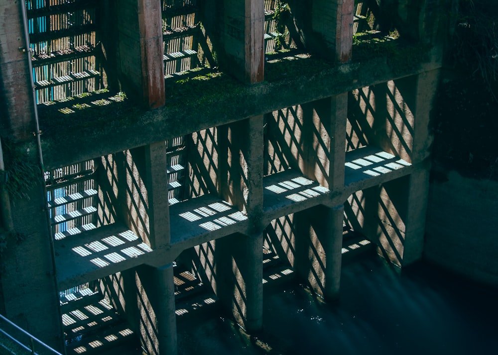 shadows cast on the side of a bridge