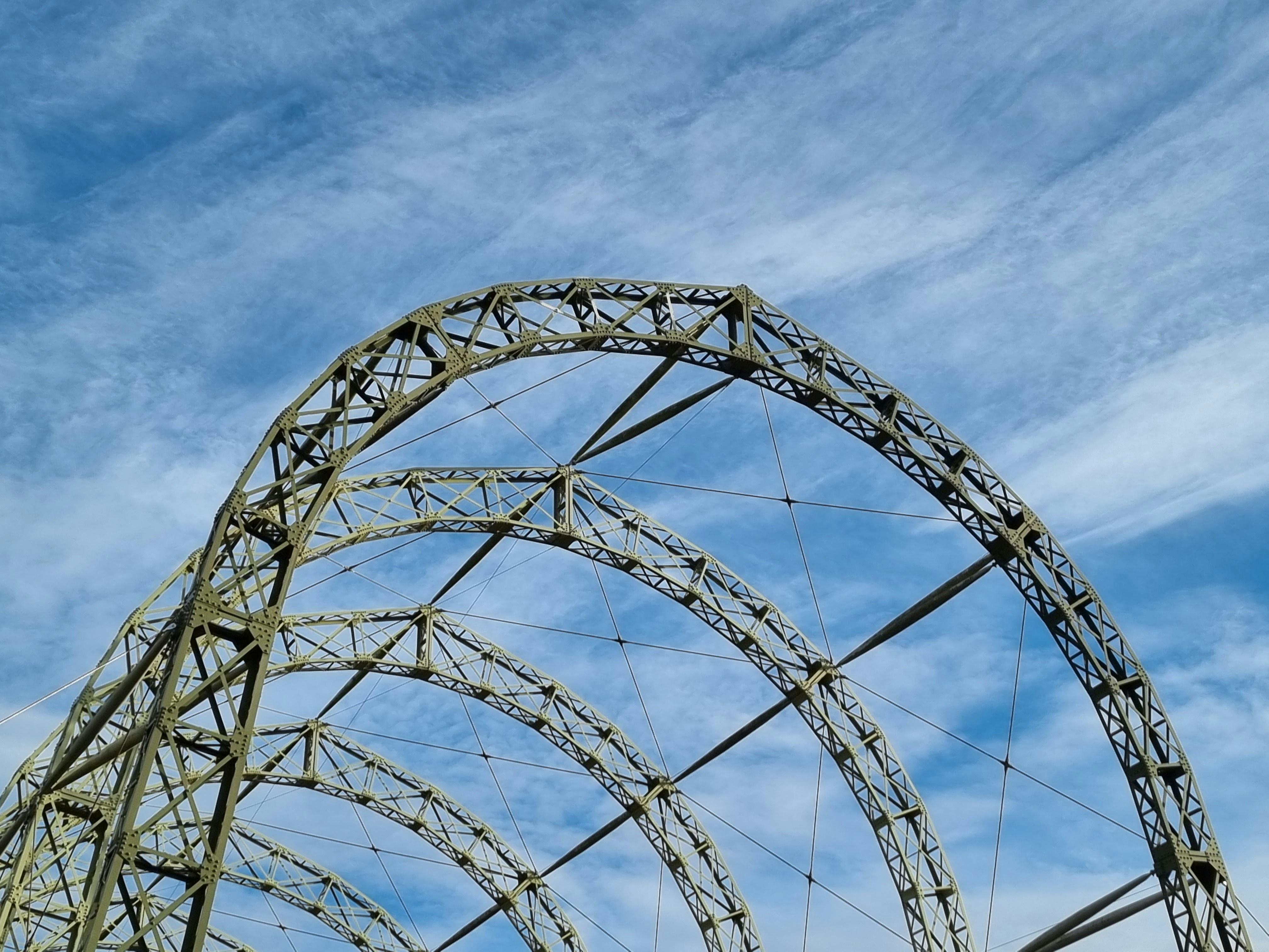 a roller coaster going through the air on a sunny day