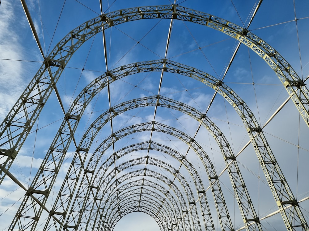 a very tall metal structure with a sky in the background