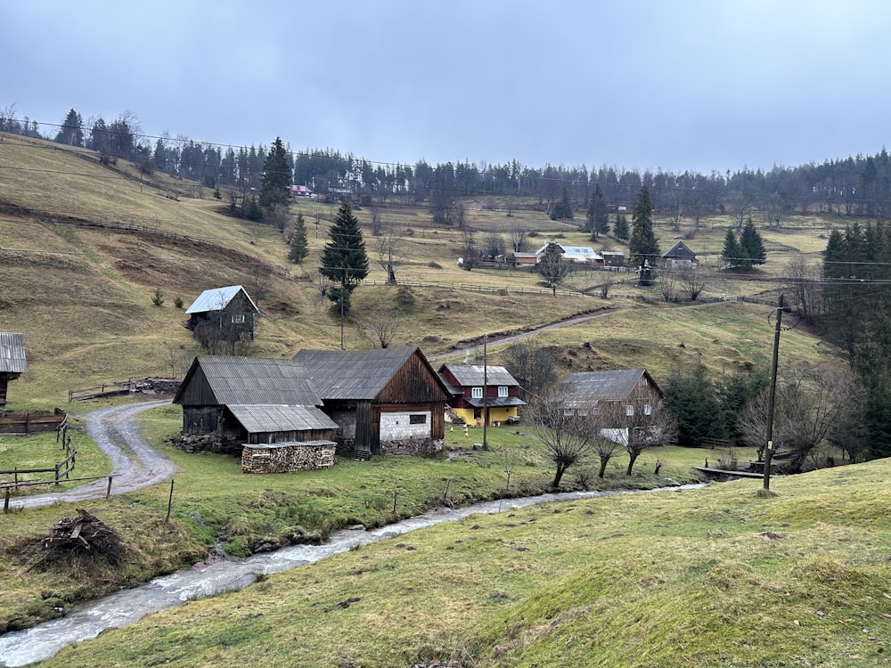 a farm with a stream running through it