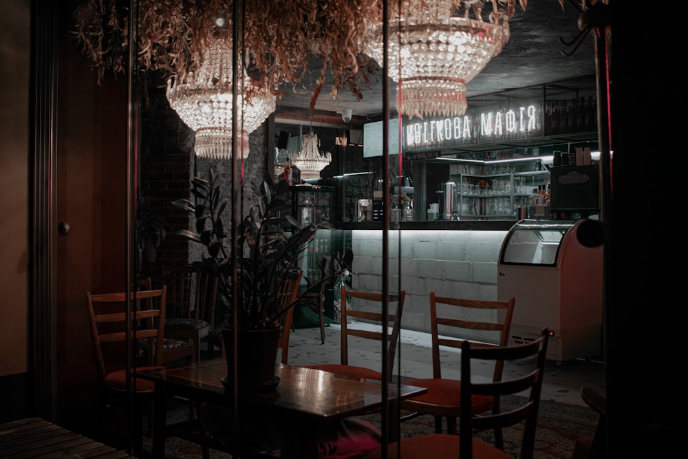 a restaurant with a chandelier hanging from the ceiling