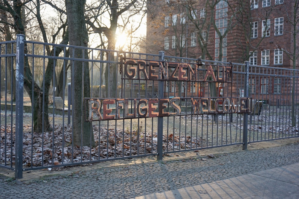 a fence that has a sign on it