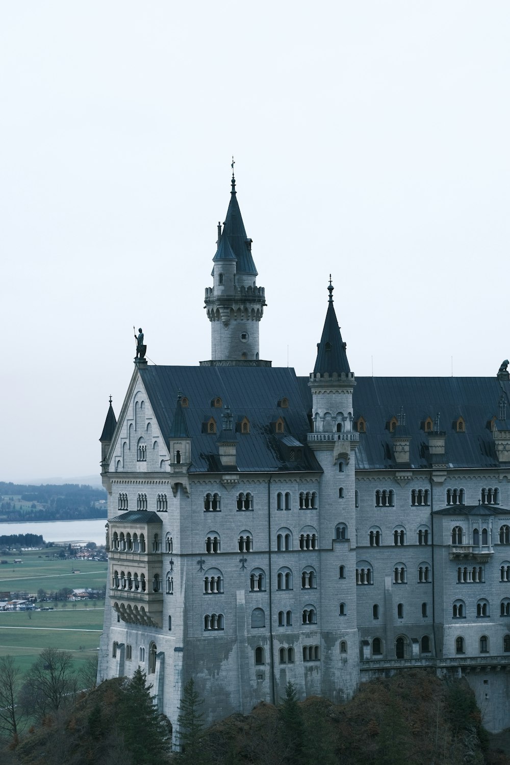 a large castle with a clock on the top of it