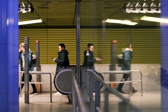 a group of people standing around a train station
