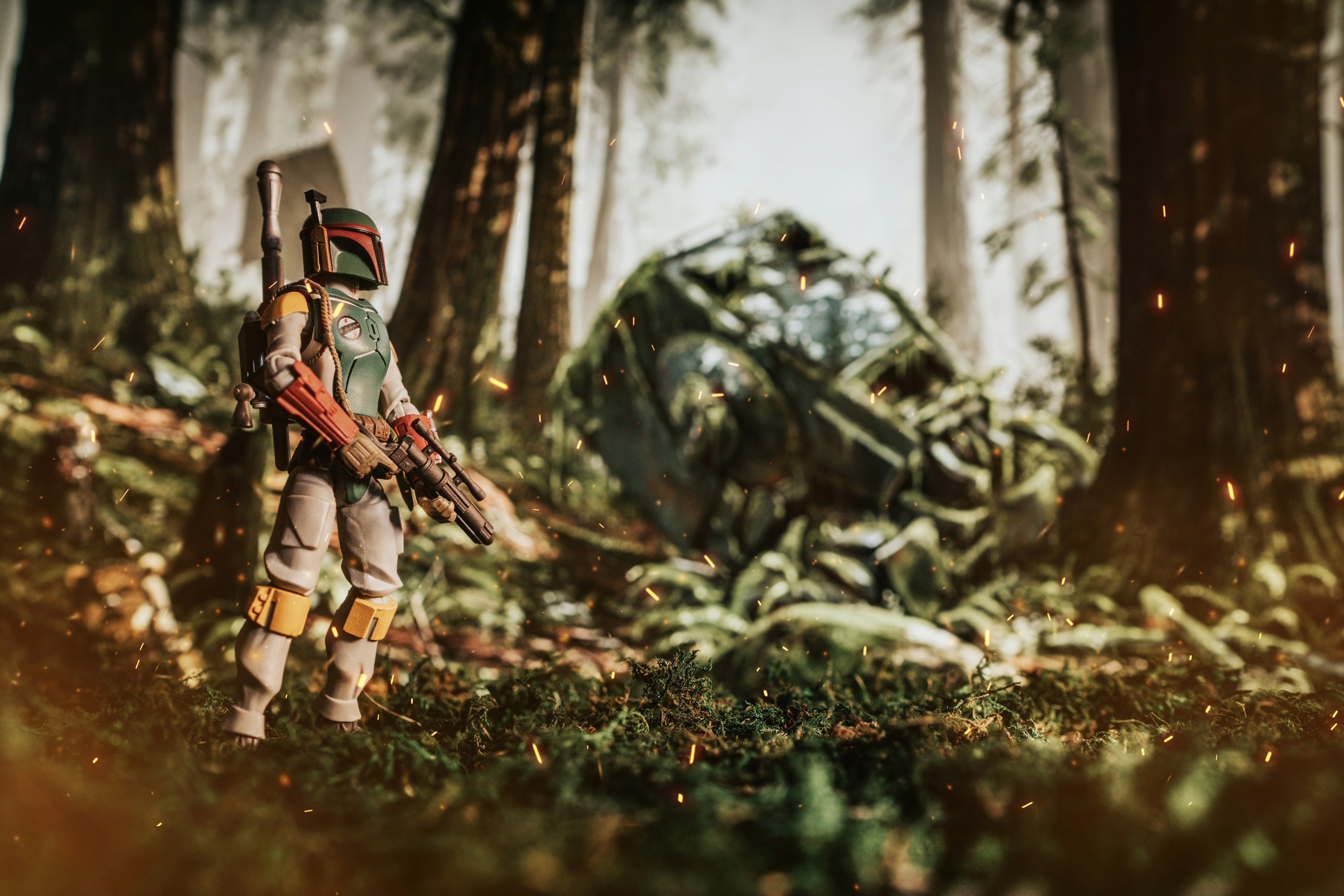 a man with a rifle standing in the woods