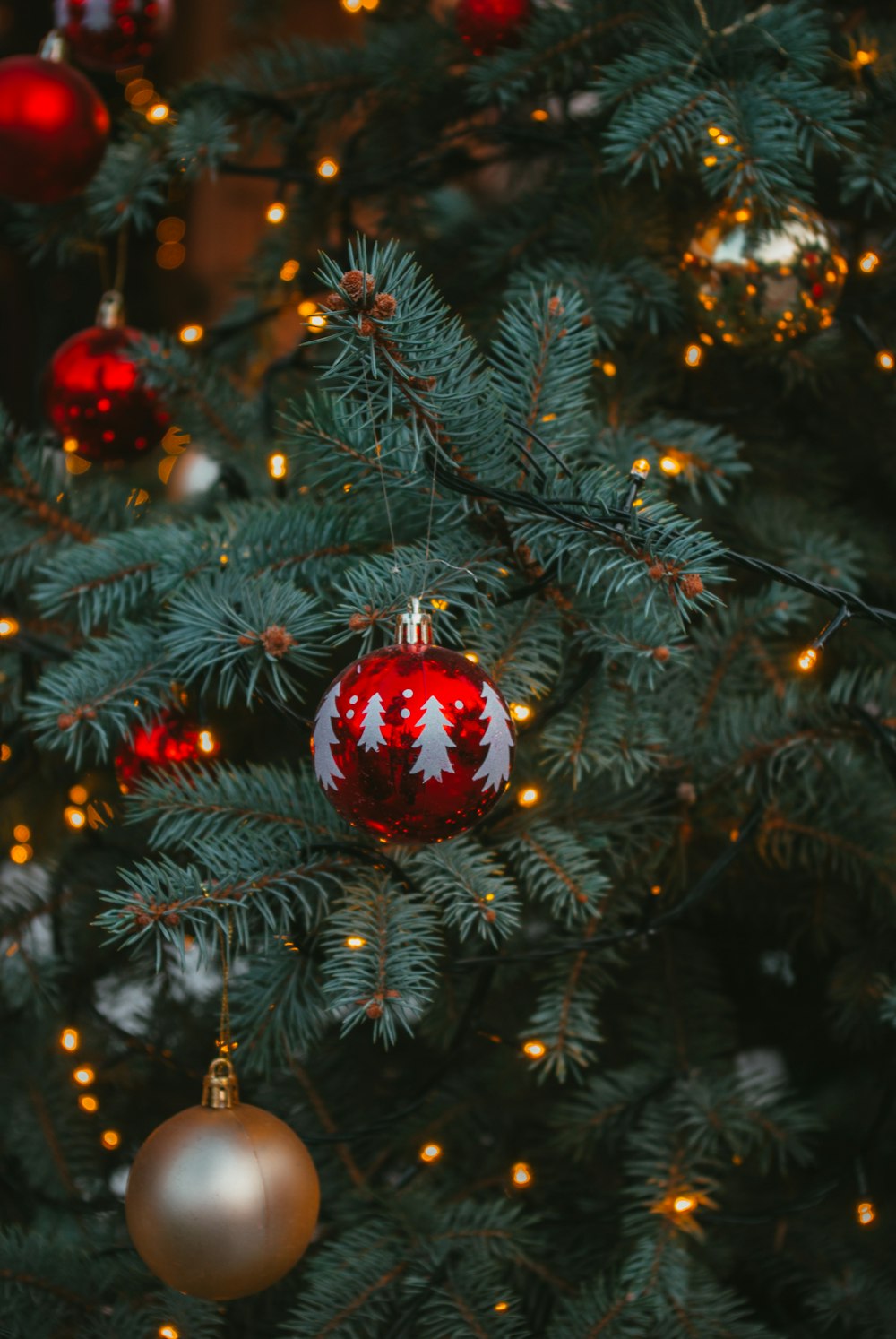 a christmas tree with ornaments hanging from it