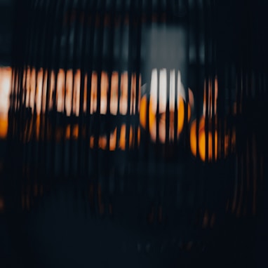 a close up of a bird cage with a blurry background