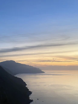 Scenic view of Mallorca coastline at sunset, reflecting calm and trust.