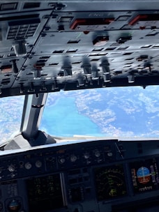 A high-res image of a pilot wearing waterproof boots in an aircraft.