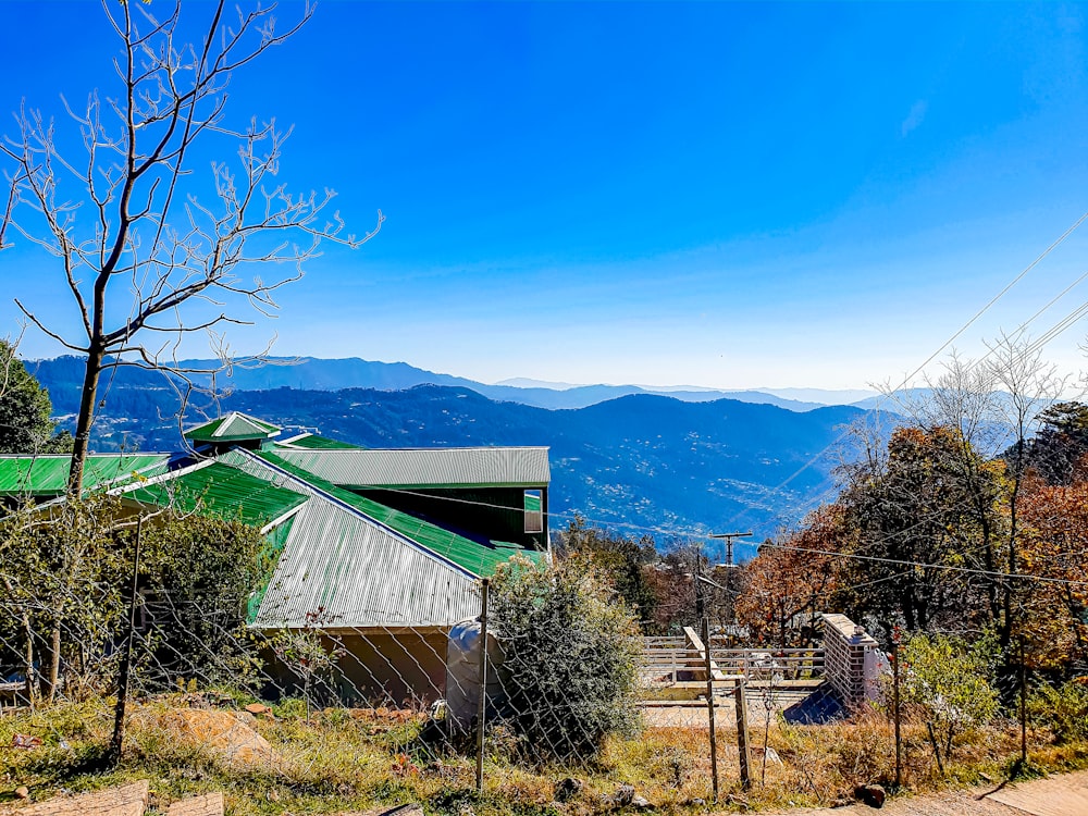 a view of the mountains from the top of a hill