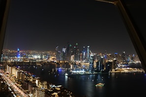 A night cityscape viewed through the Shynr app, with shimmering glitter effects enhancing the lights