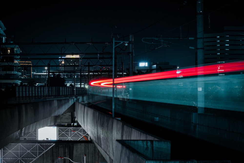 a long exposure photo of a train going through a tunnel