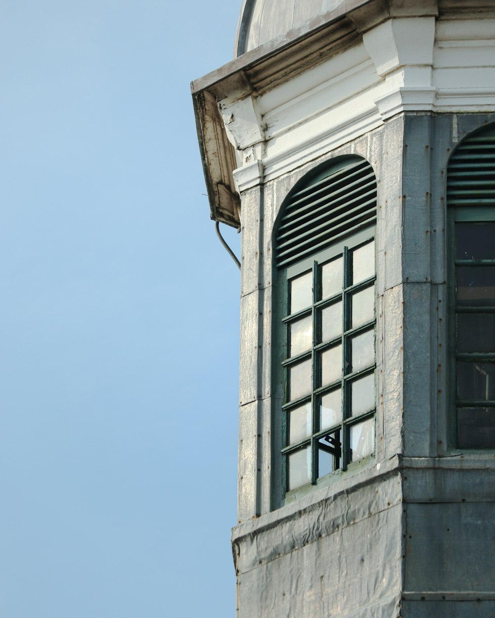 an old building with a window and a clock