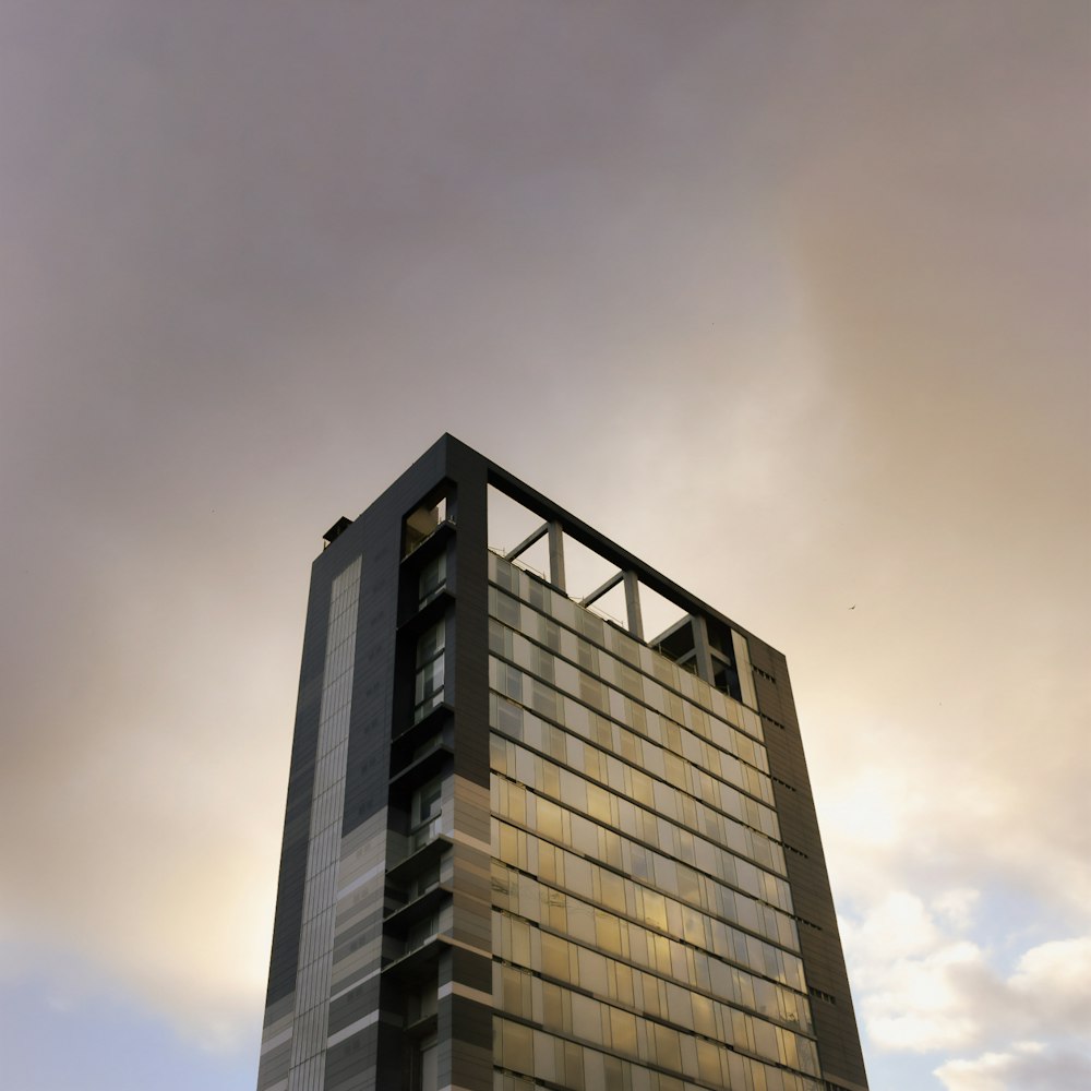 a tall building with a sky in the background