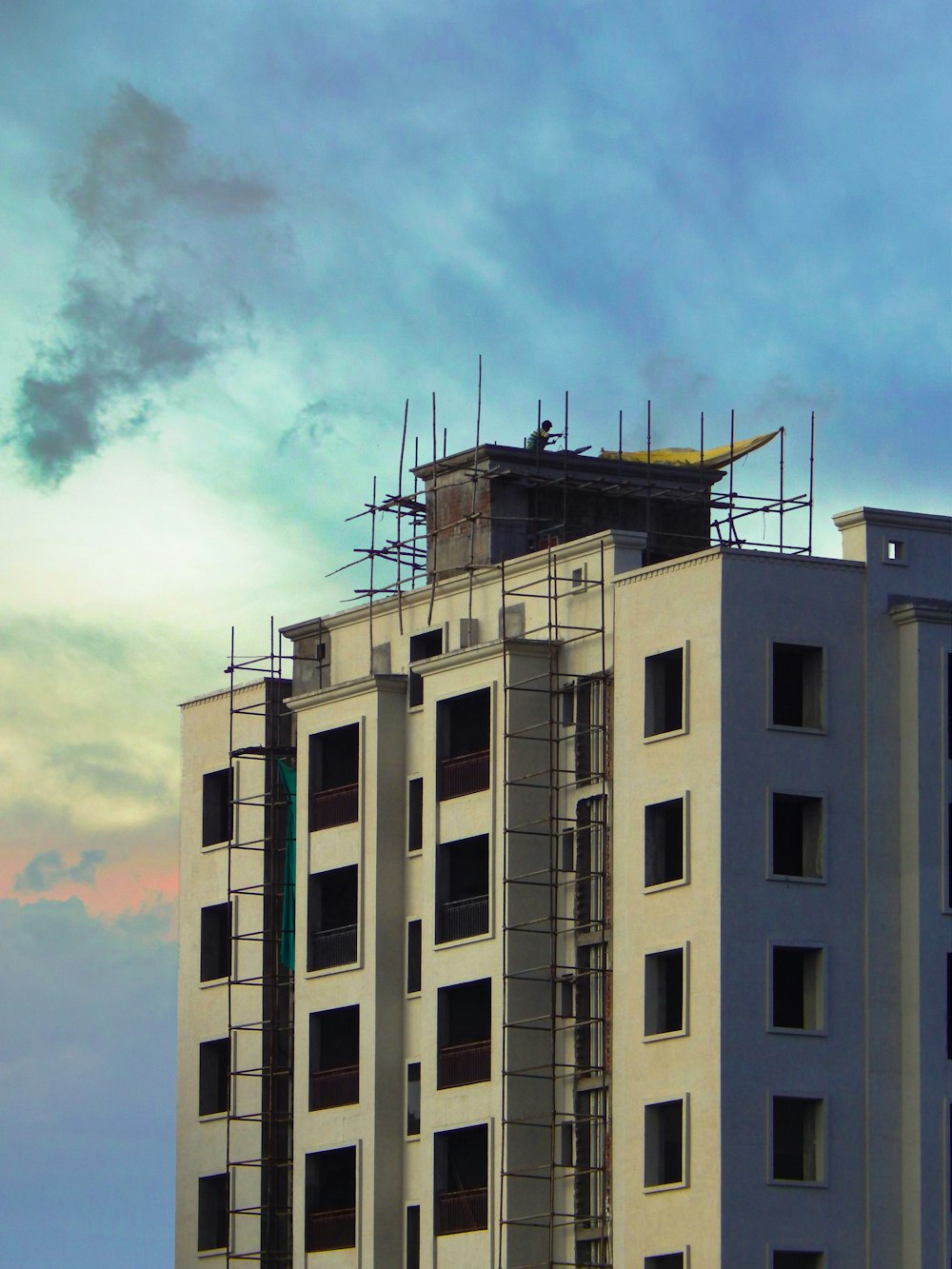 a tall building with scaffolding on top of it