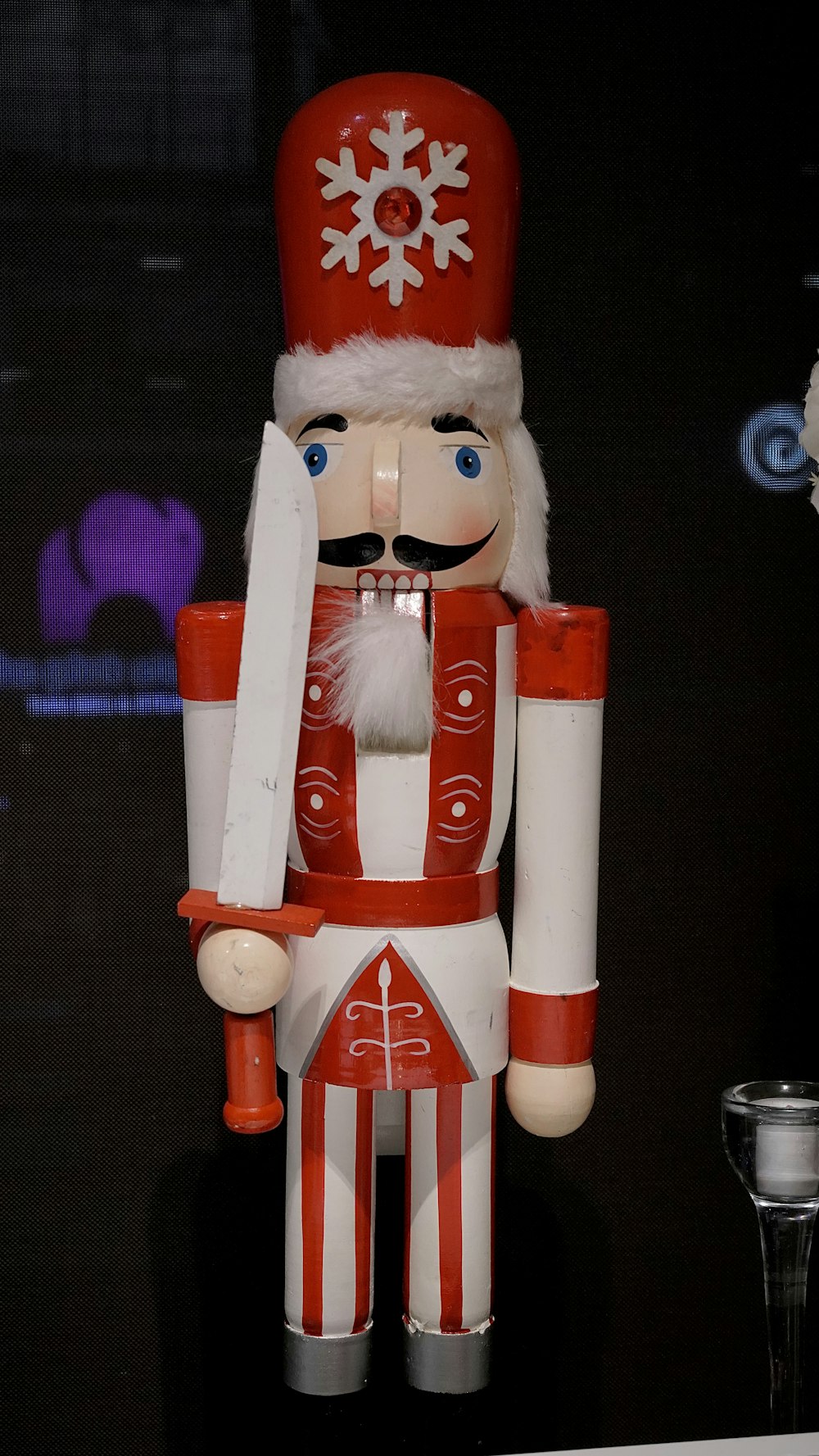 a nutcracker with a knife in his hand