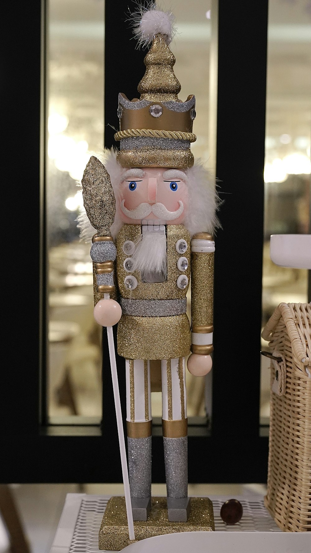 a nutcracker is standing next to a basket