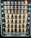 A vending machine filled with rows of brown paper cups, each labeled with different flavors and prices. The cups are neatly organized within clear slots across several rows and columns.