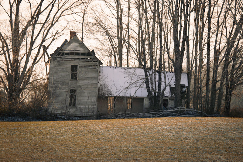 Weathered run-down farmhouse needing renovation