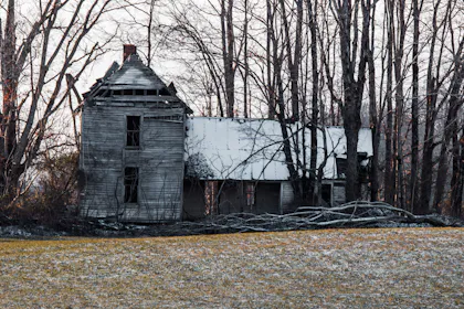 Country farmhouse across an open field