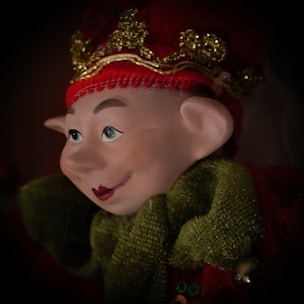 Colorful cartoon elf holding a musical note with festive decorations.