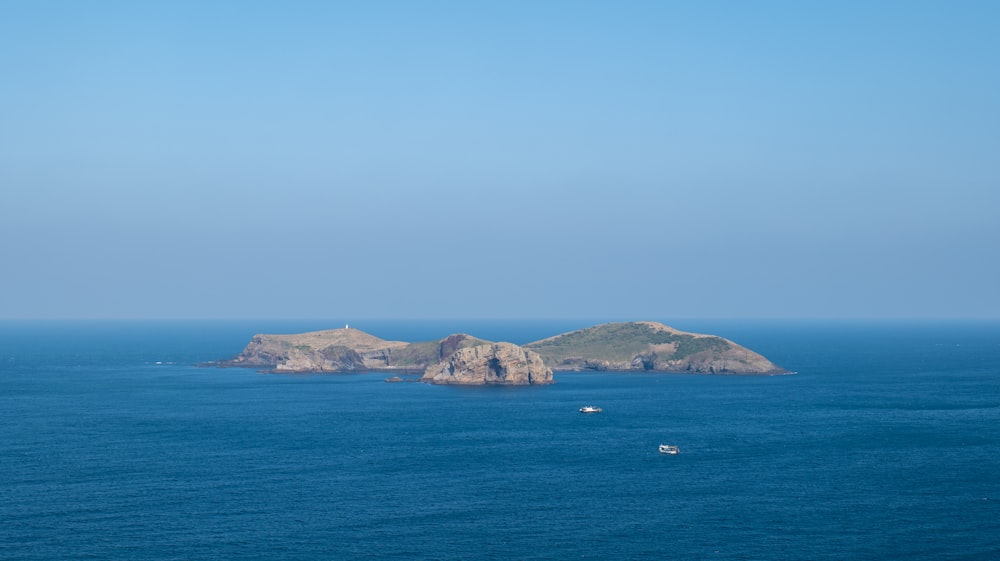 a couple of small islands in the middle of the ocean