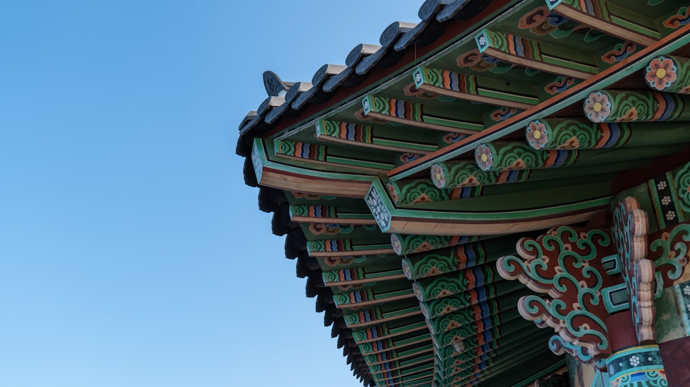 the roof of a building with a blue sky in the background