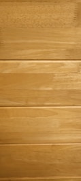 Several horizontal wooden planks with a smooth finish and natural grain patterns.