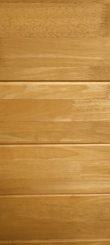 High-quality wooden planks ready for delivery, highlighting smooth finishes and natural grain.