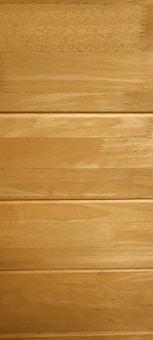 Several horizontal wooden planks with a smooth finish and natural grain patterns.