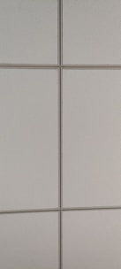 A pattern of rectangular, light-colored ceiling tiles with small perforations and visible grid lines.