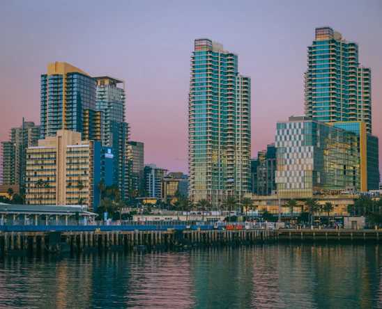 Elegant Miami skyline at sunset showcasing luxury high-rise condos and waterfront properties.