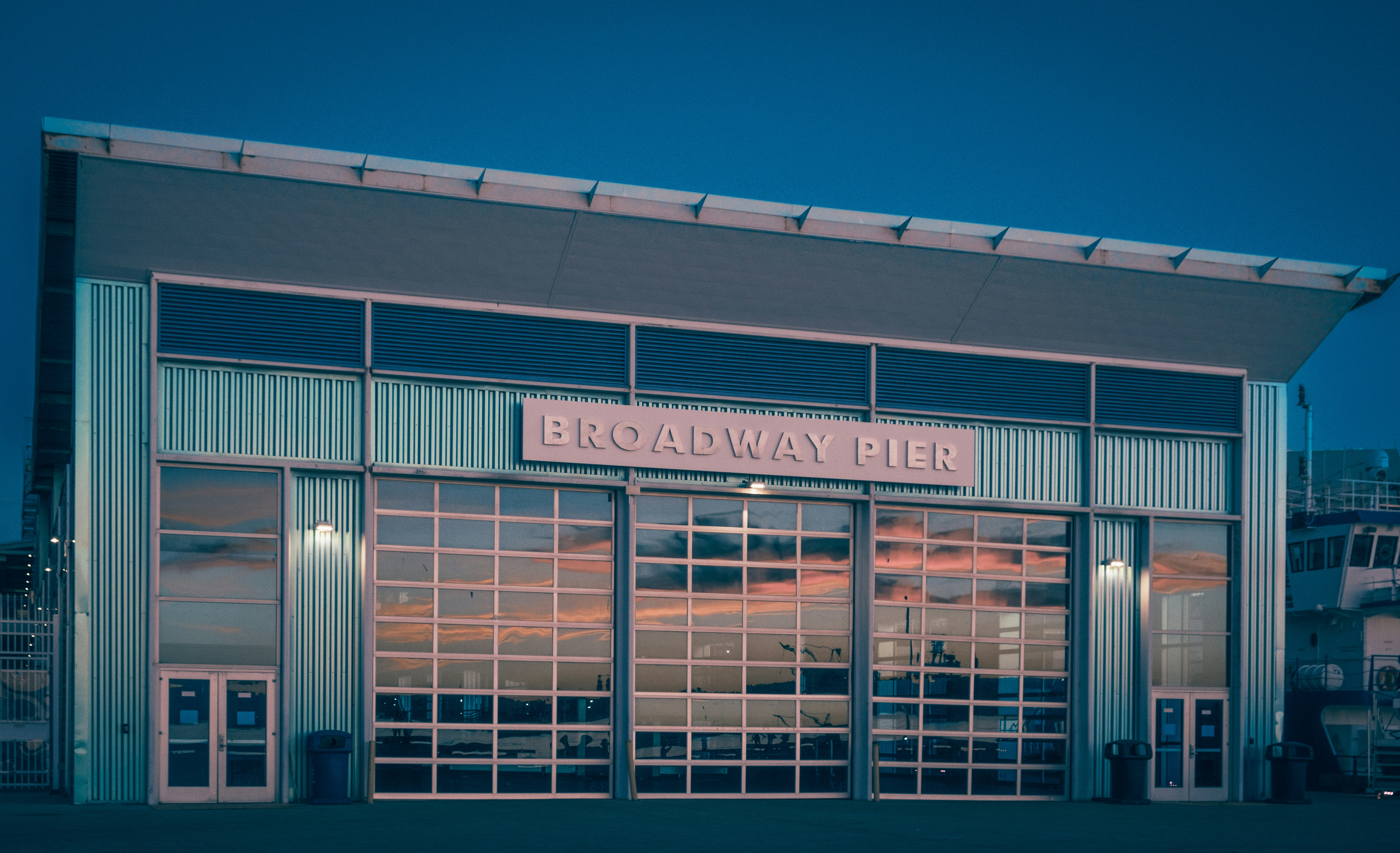 the front of a building with a sky in the background