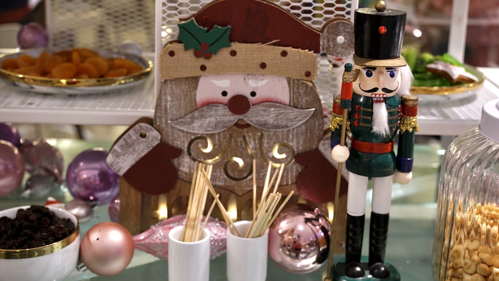 a nutcracker and a nutcracker figurine on a table