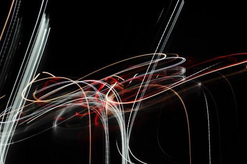 An abstract pattern of colorful light trails representing the flow of thoughts and ideas.