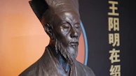 A subtle portrait of a traditional Chinese scholar, softly shaded and deeply expressive.