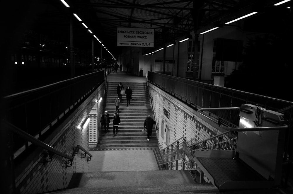 a group of people walking down a flight of stairs