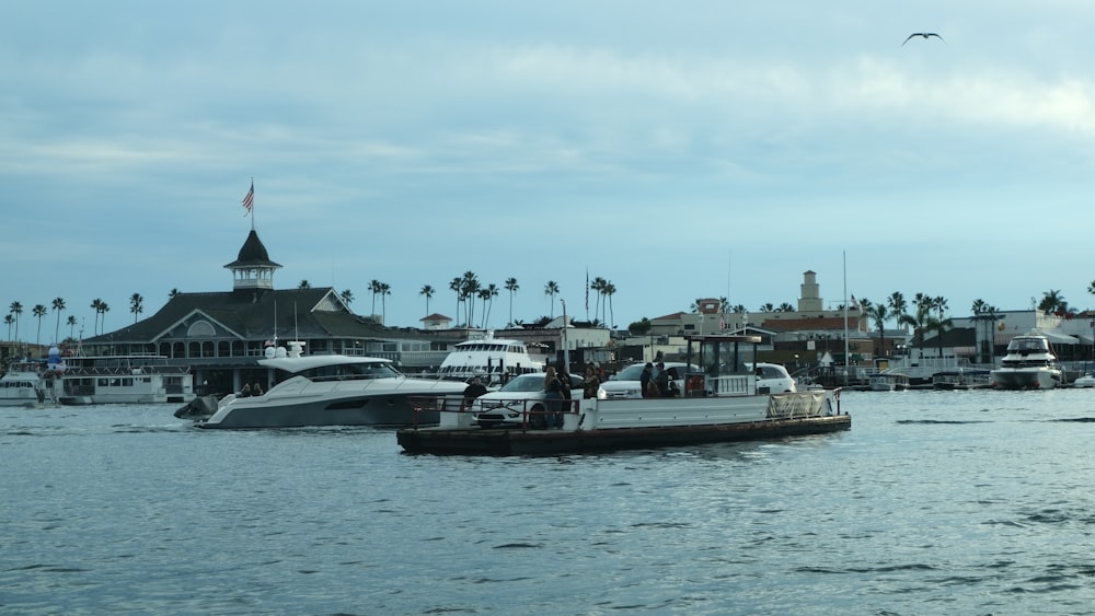 a group of boats floating on top of a body of water