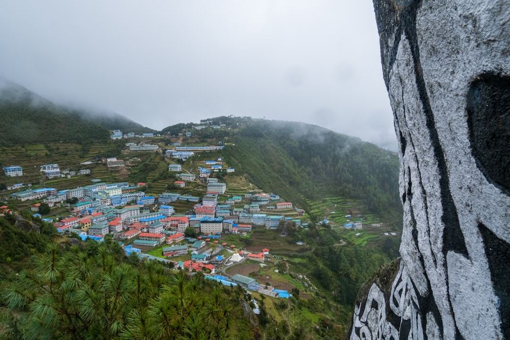 a view of a village in the mountains