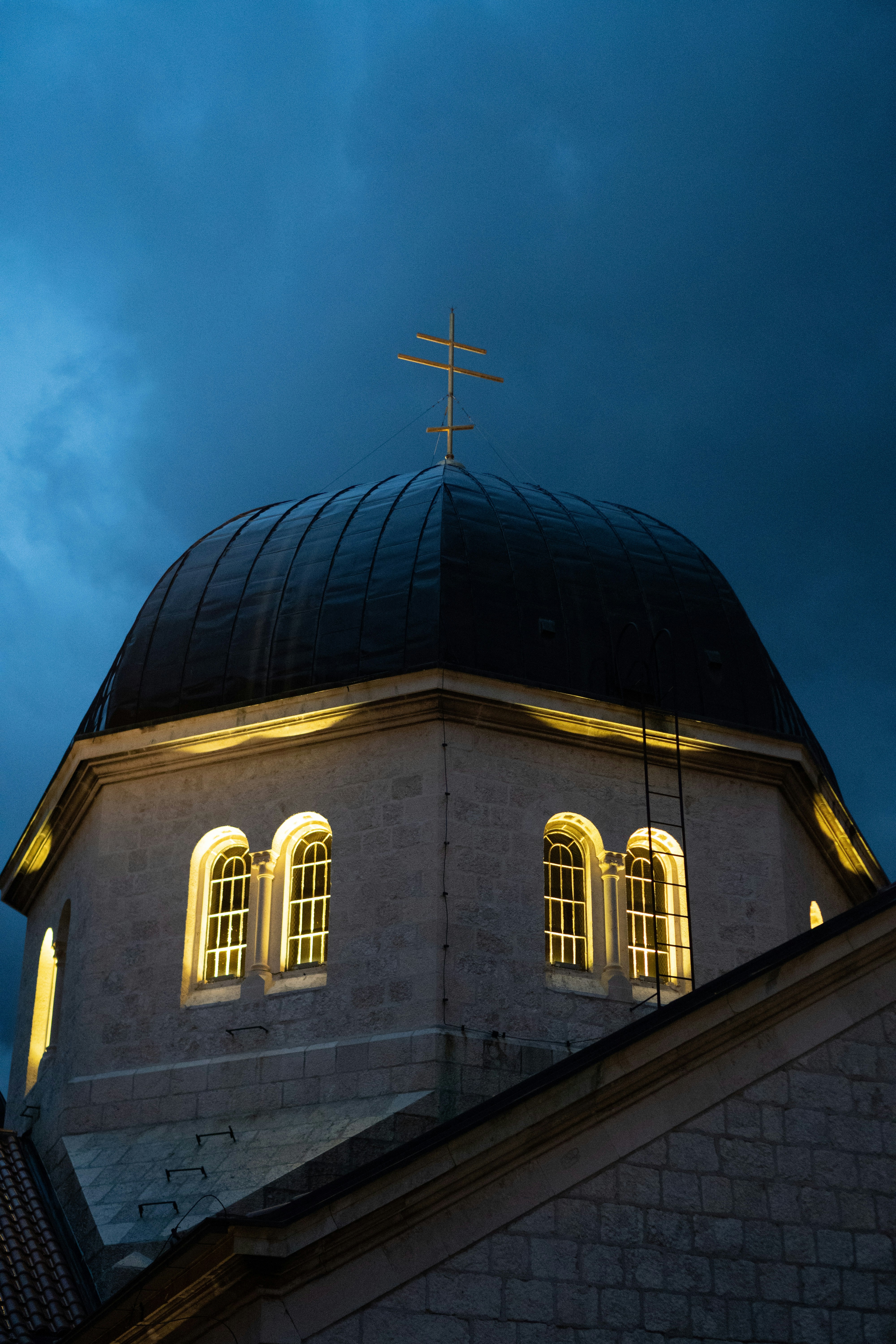 a building with a cross on top of it
