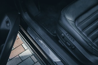 a pair of black luggage sitting on top of a floor