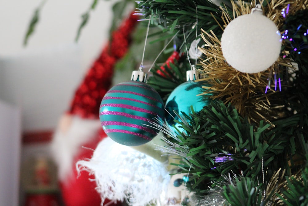 a close up of a christmas tree with ornaments