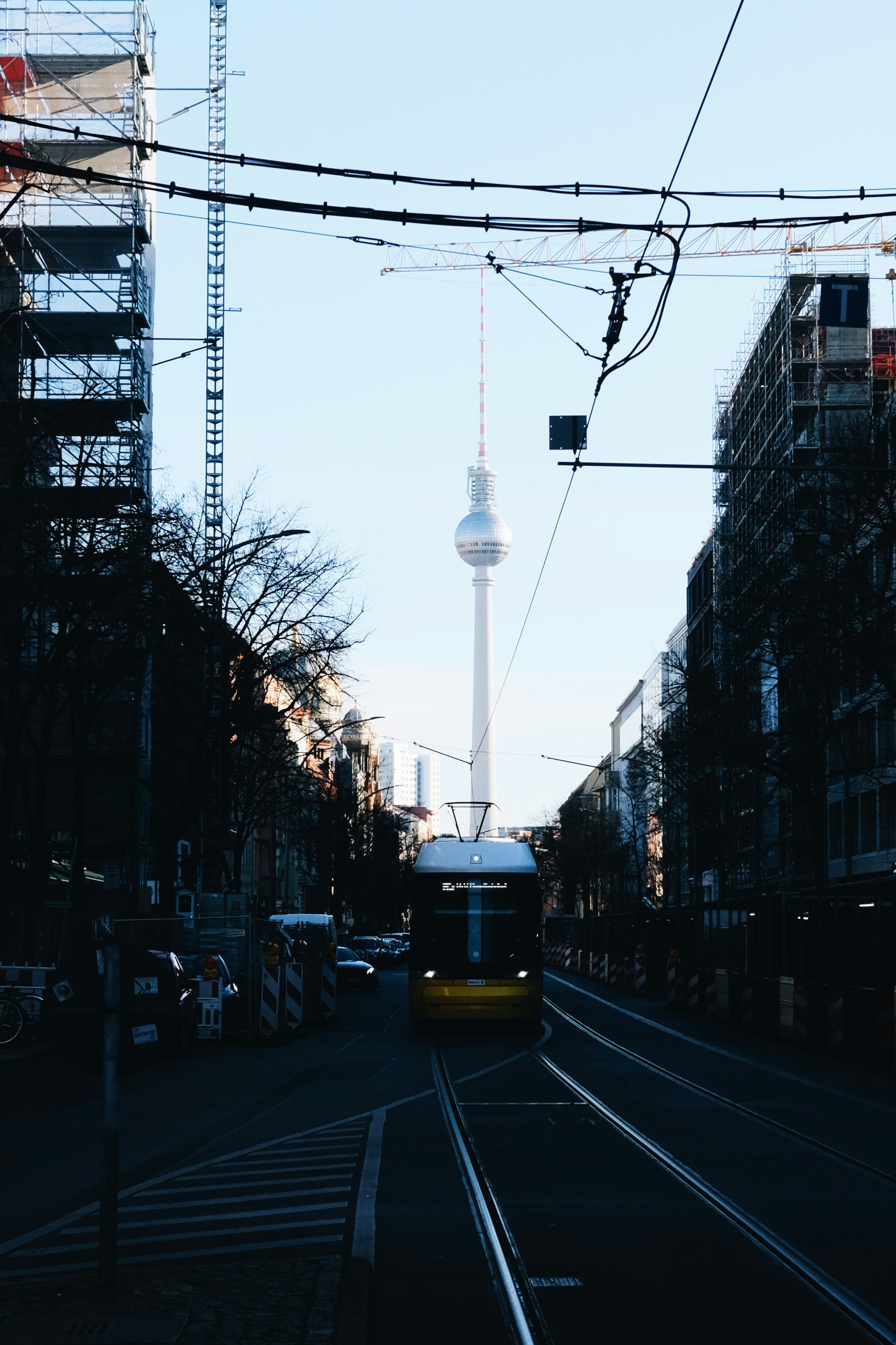 a city street with a train on the tracks